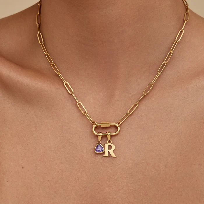 Carabiner initial birthstone necklace flat lay — Olivia Jewelry
