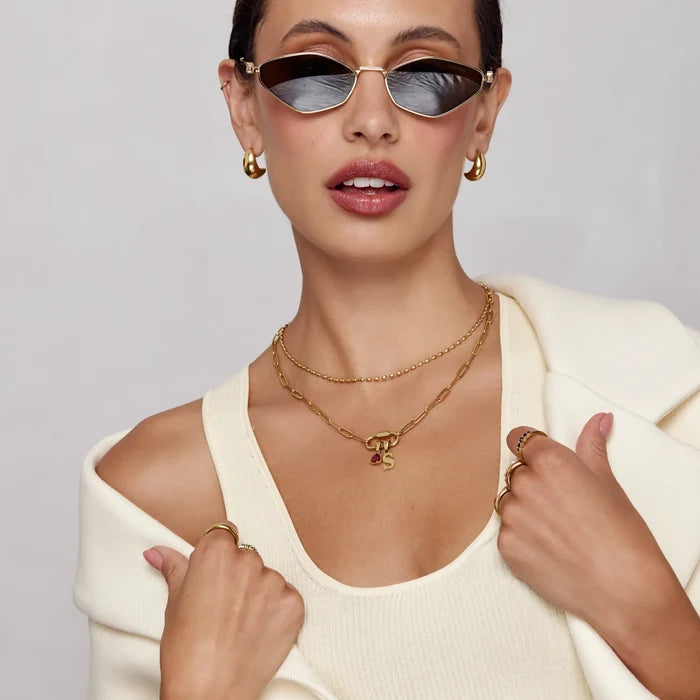 Gold carabiner charm lock necklace worn on model — Olivia Jewelry