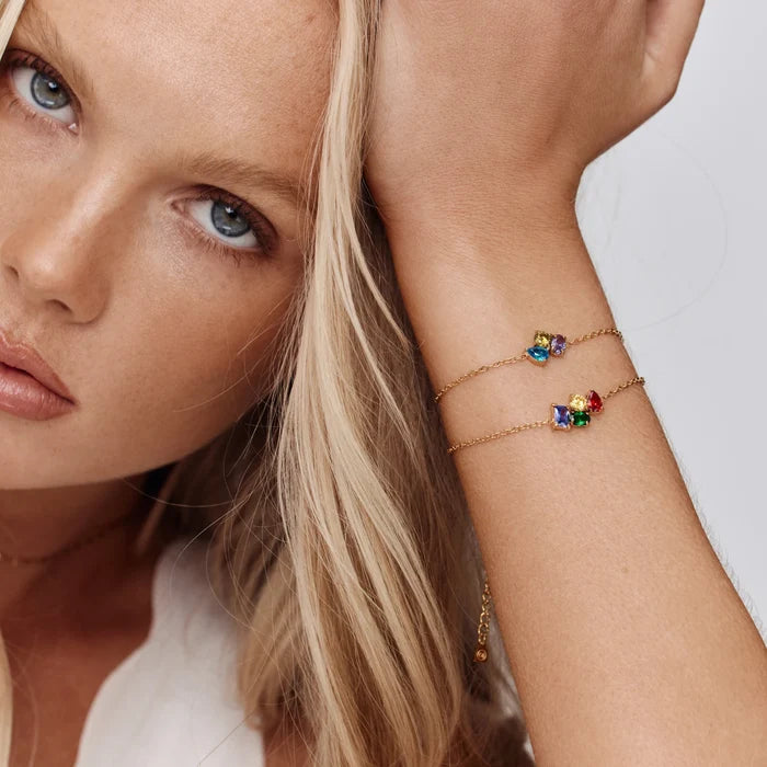 Model wearing two Custom Legacy Birthstone Bracelets with mixed birthstone combinations