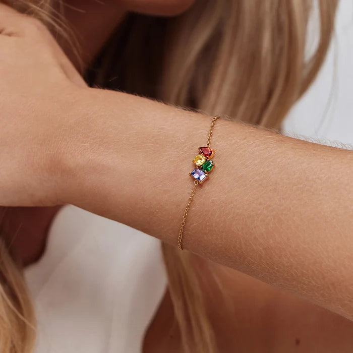 Custom Legacy Birthstone Bracelet with four colourful birthstones worn on wrist — Olivia Jewelry