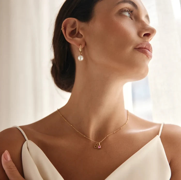 Model wearing Gem Initial Necklace with letter B and pink tourmaline birthstone — Olivia Jewelry