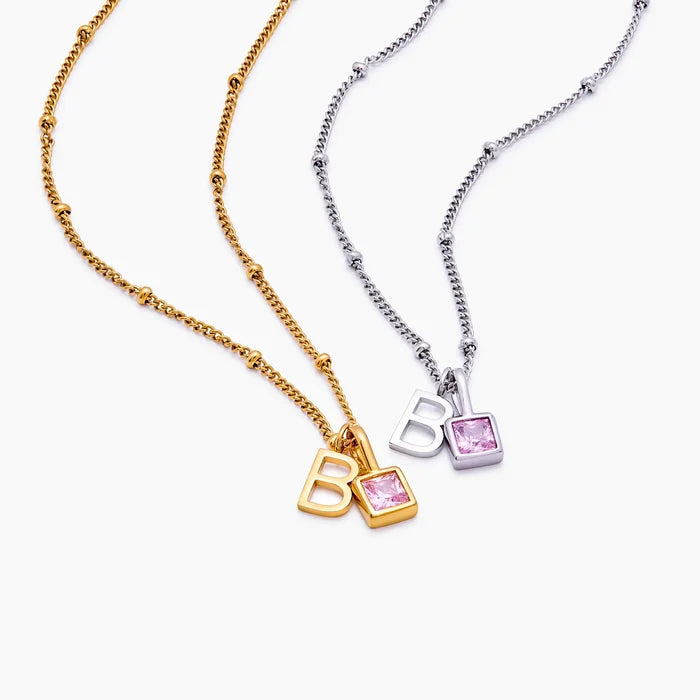 Gem Initial Necklaces in gold and silver finishes with letter B and pink birthstone — Olivia Jewelry