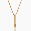 Gold necklace with a vertical bar pendant on a white background