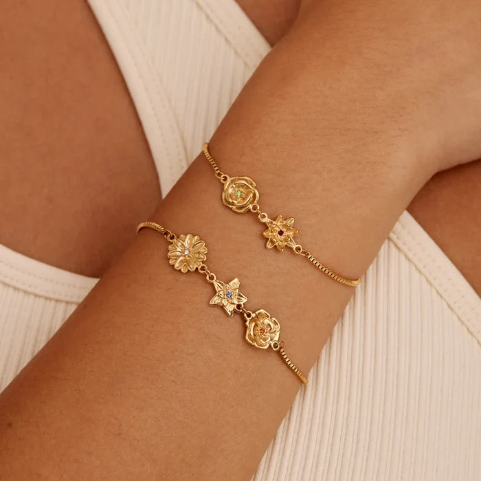 Birth flower charm bracelet close-up — Olivia Jewelry