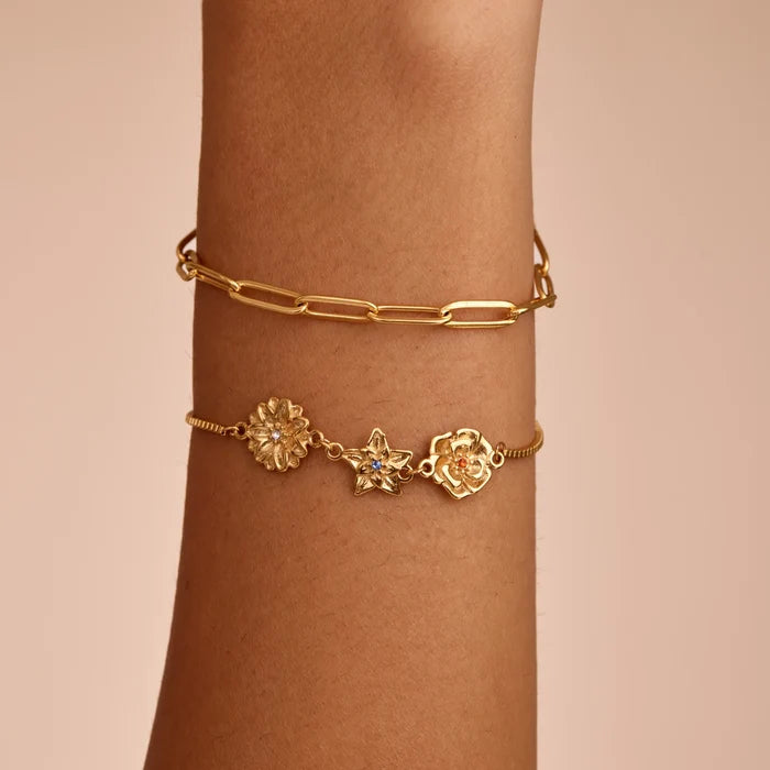 Custom birth flower bracelet flat lay — Olivia Jewelry